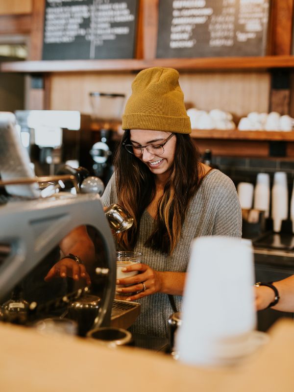 qsr waiter smile while serving coffee